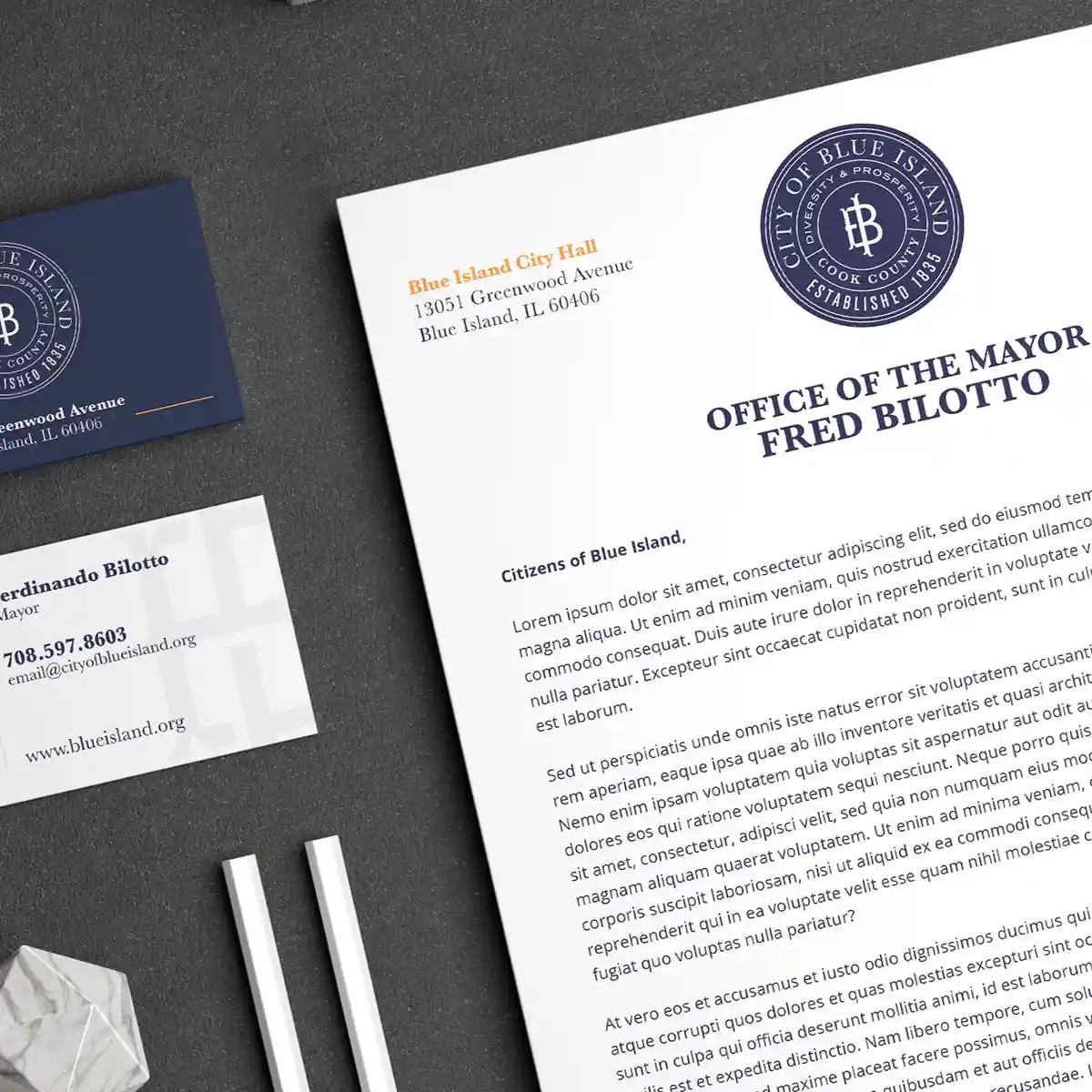 Project Blue Island - A letterhead and business card design shown on a concrete background for the city of Blue Island